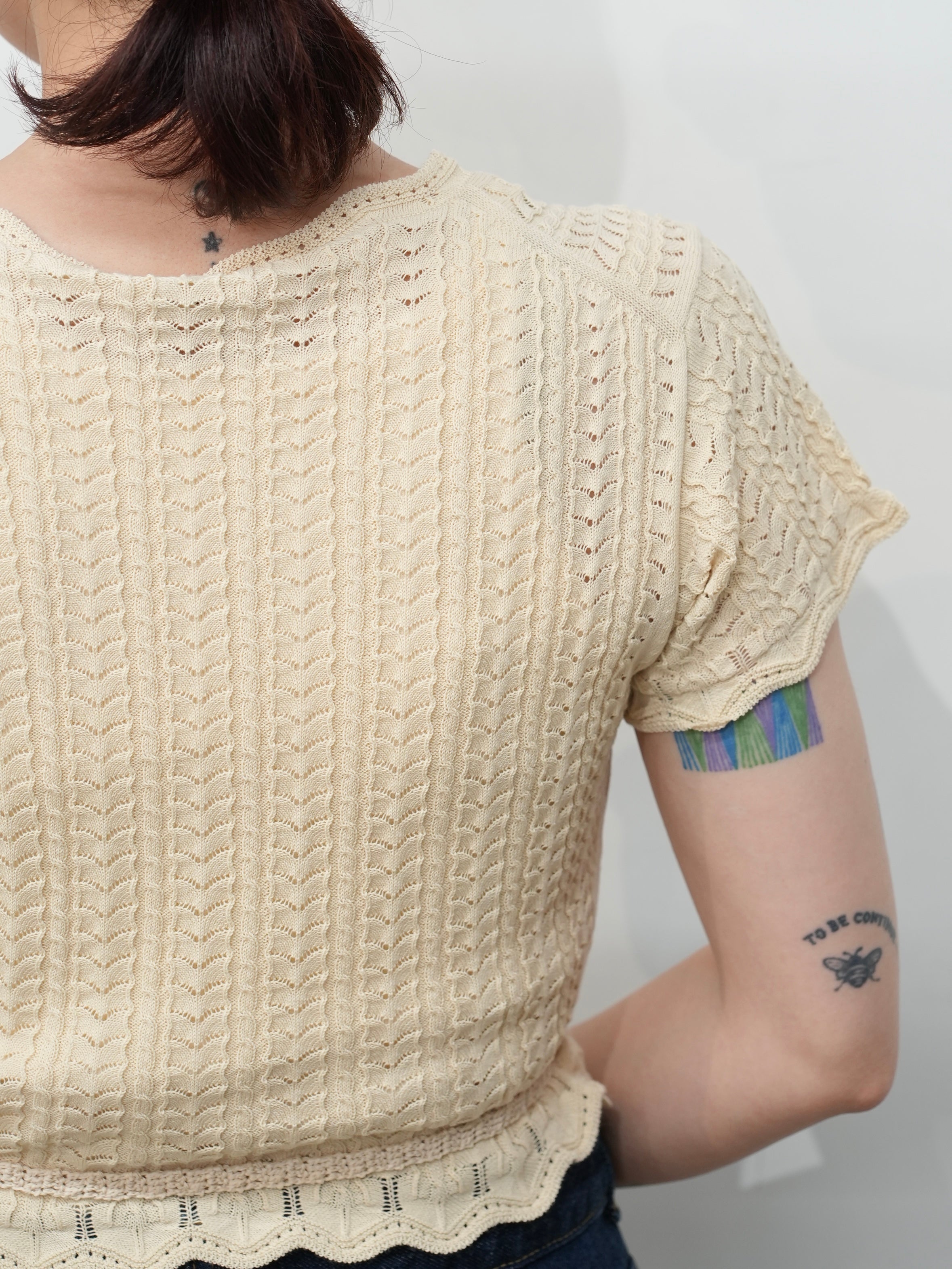 Lace knit cache-coeur top